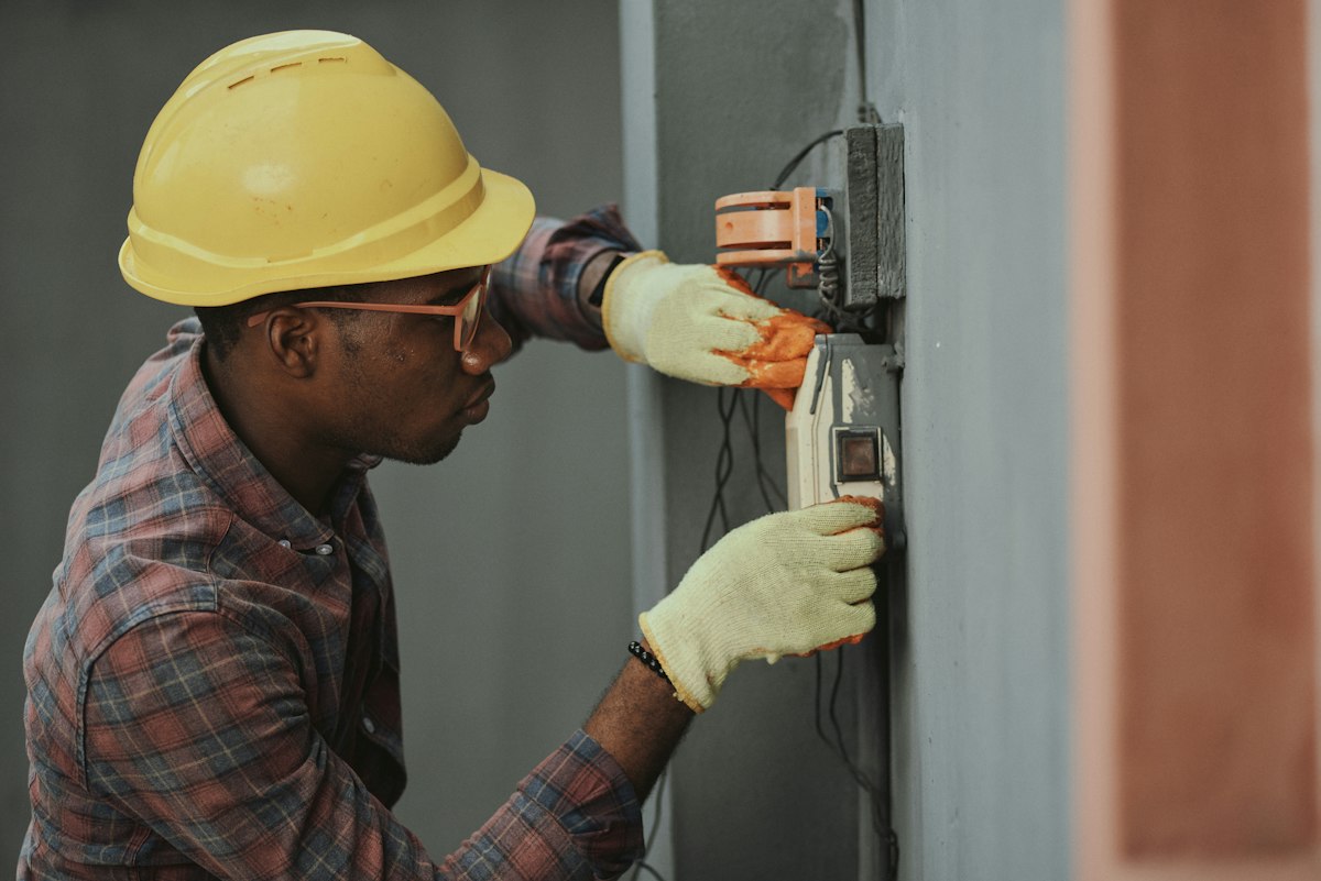 Service technician inspecting residential mechanical equipment